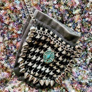 Studded houndstooth wristlet